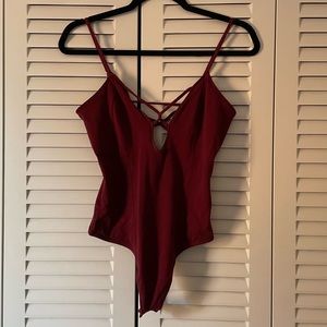 Maroon Express body suit.